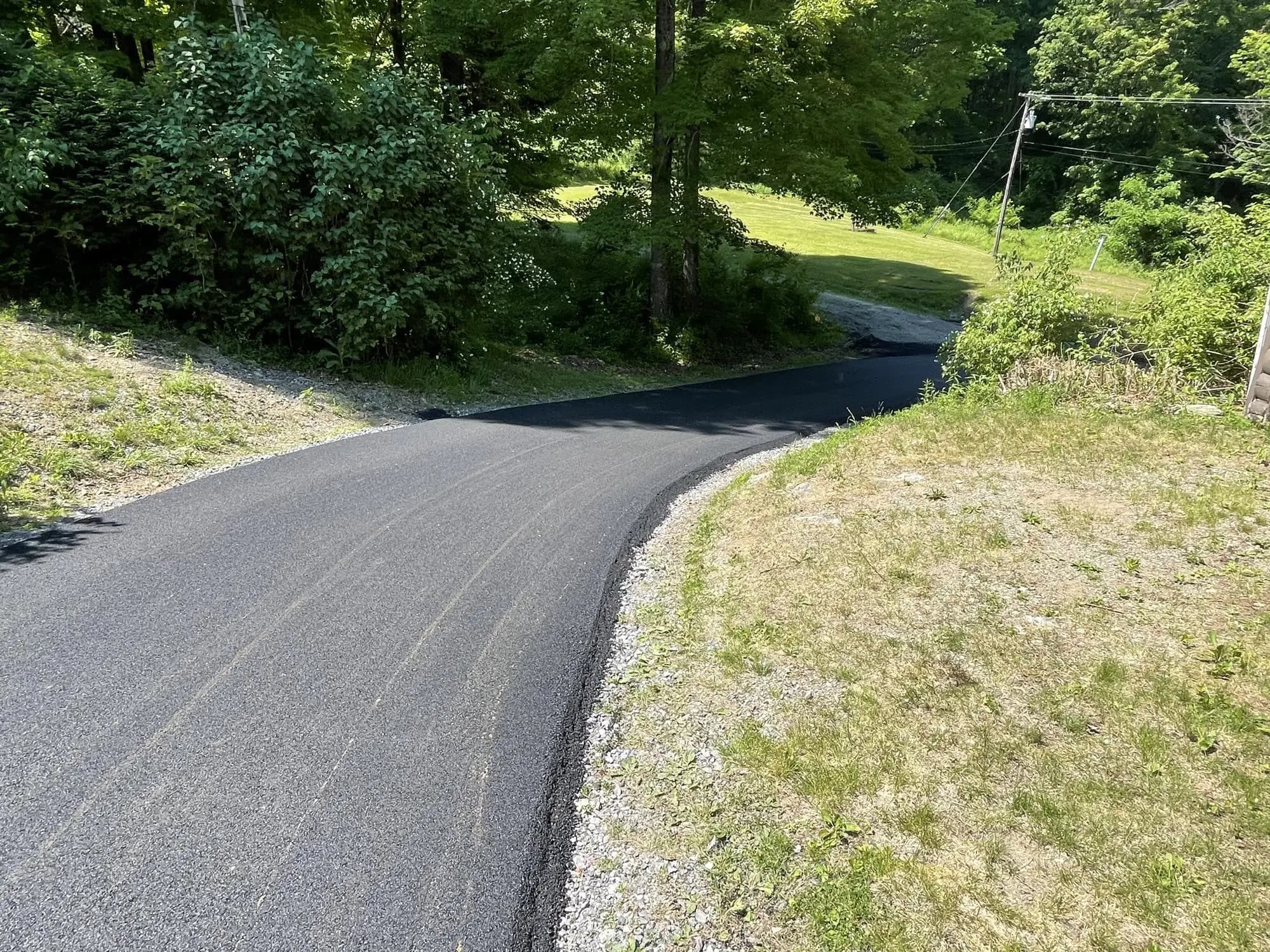 Asphalt driveway installation by Muddy Driveways and Paving