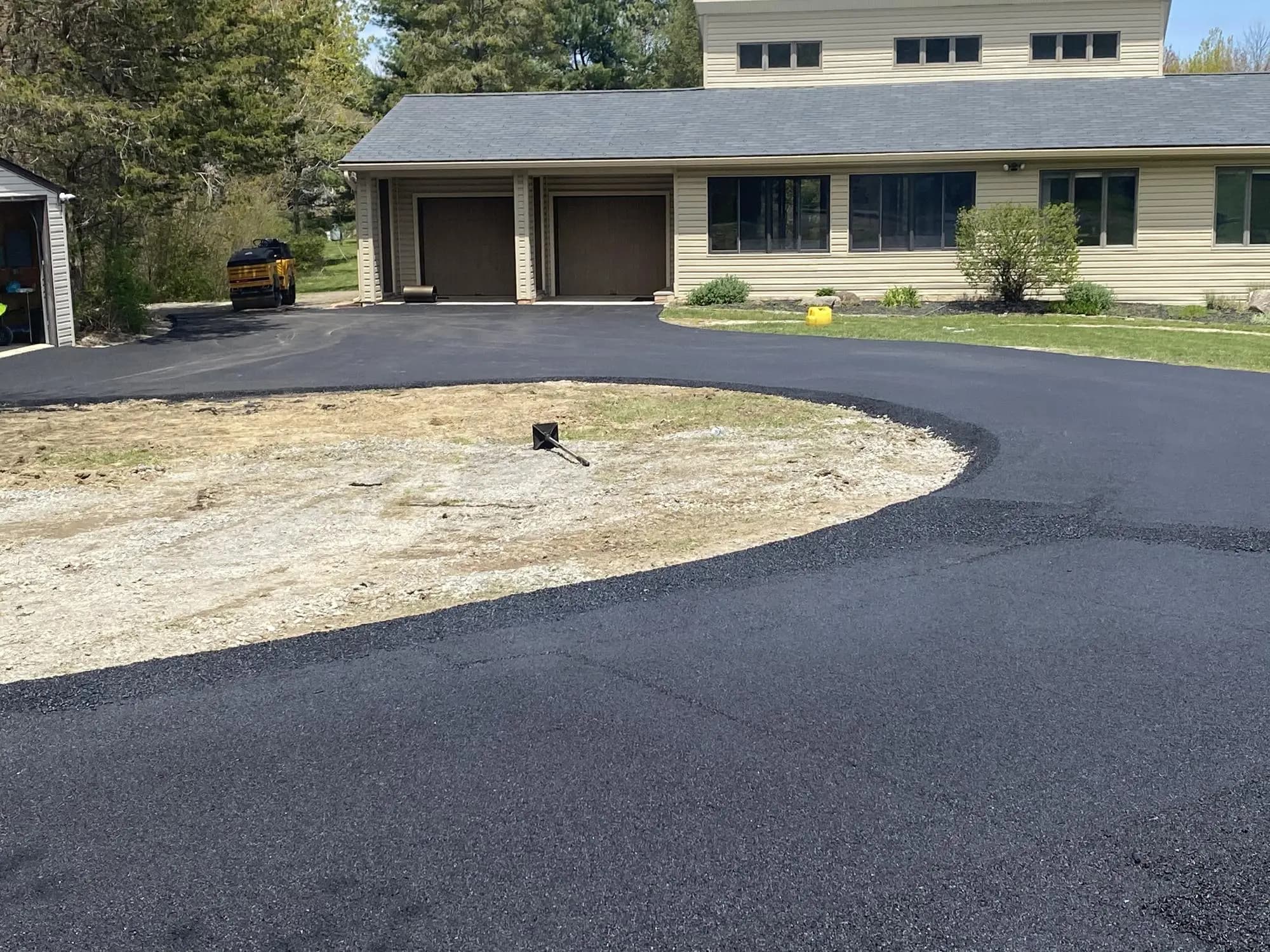 Asphalt driveway installation by Muddy Driveways and Paving